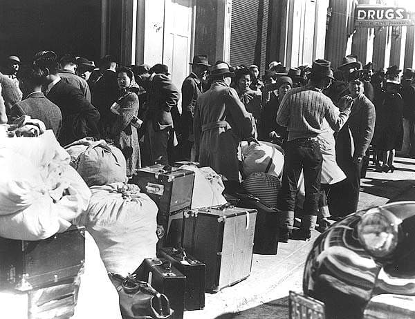 Japanese US citizens and Japanese-Americans traveling to an internment camp. Camps were located in Washington state, Idaho, Colorado, Texas, and other western states....The concept of "The Other" - portrayed as a Twilight Zone alien in the Cold War e