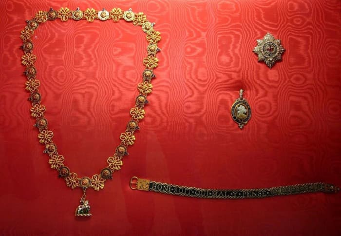The insignia of the Order of the Garter: The collar, star, badge and garter.