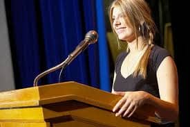 You'd lose points in a speech, table topics, or evaluation contests simply by standing behind a lecturn. Toastmaster audiences like to see the whole speaker.