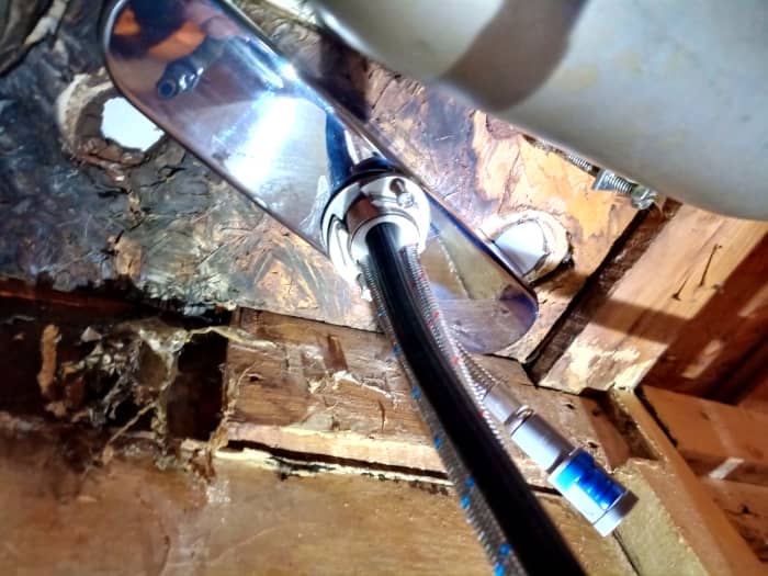 I used the old faucet's deck plate to provide a solid surface to mount WaterSong faucet's washer and locknut