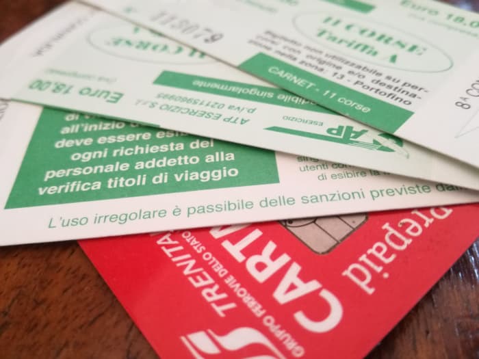 A travel card and some tickets. There are several credit cards providing perks for frequent travelers.
