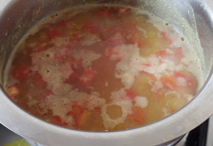 Add salt to taste. Add water if required to adjust the consistency. Let the rasam boil for 5 minutes. Switch off the flame.