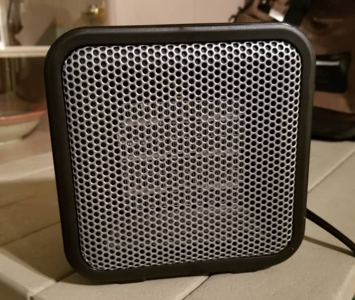 This small heater takes the edge off the cold air and warms up small spaces nicely. Just be careful not to touch it when it is turned on.