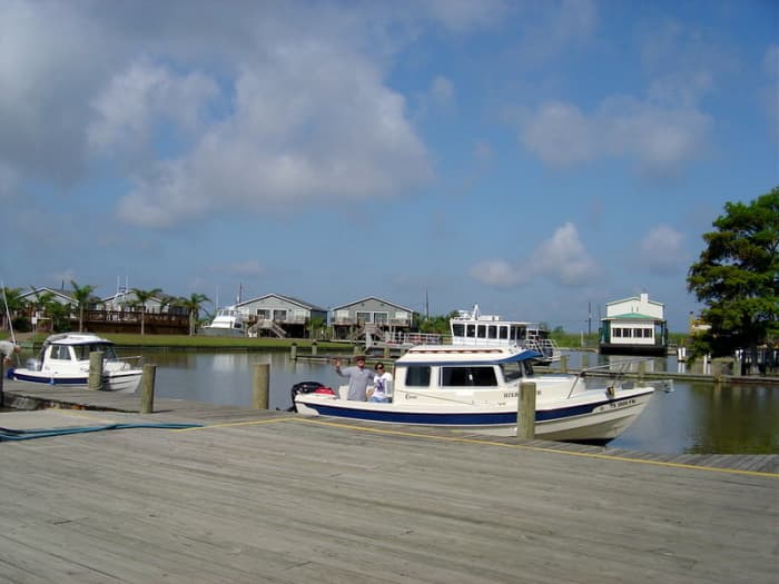 Two small pocket cruisers at a marina in Venice, Louisiana, preparing to start their trip to explore the mouth of the Mississippi River.