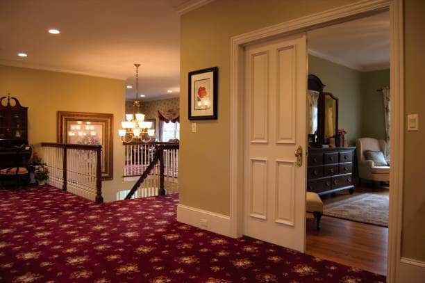 Look for lively carpeting to add to your hallways. Chandeliers light the path. Stunning golden fixtures mesmerize guests.