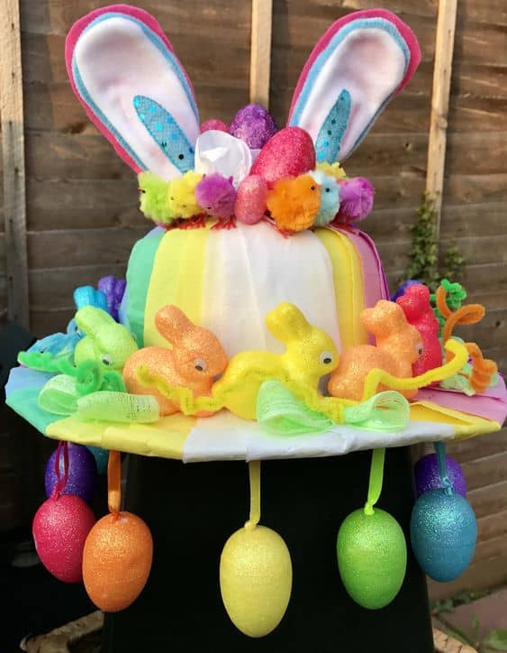 Why not transform a dollar store hat into an Easter hat? Dangle plastic eggs on ribbons from the brim, and don't forget the ears on top.