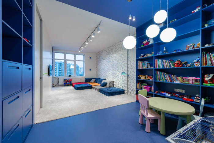 Repurposed bookshelves offer an impressive explanation for stowing and presentation in a child’s bedroom