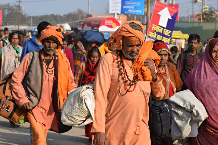 Hindus in the company of two ascetics: Hindus resent conversions of their members to other faiths