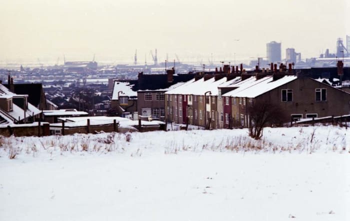 Rebuilt cottages on Old Row in the California estate (Klondike City) with industry beyond at Grangetown