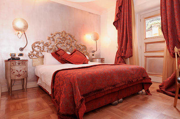 This bedroom is really close for what I want out of an Aries and Virgo bedroom design. There is a little too much red and the headboard is too ornate for Virgo's style, but overall things come together in a smart and clean way. The room looks fresh.