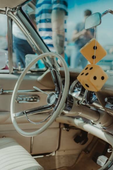 It's said that hot rodders hung the ornament to challenge others to a street race, in effect saying "Are you ready to dice with death?"