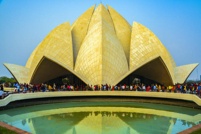Worshippers at the Bahá’í House of Worship, known as the Lotus Temple, in Delhi, India.