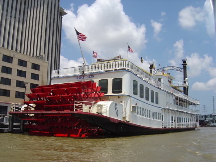 The paddlewheeler "Creole Queen" docks at Riverwalk and Canal Street in New Orleans for cruises on the Mississippi. See the French Quarter and St. Louis Cathedral, while enjoying a jazz band and Creole buffet.