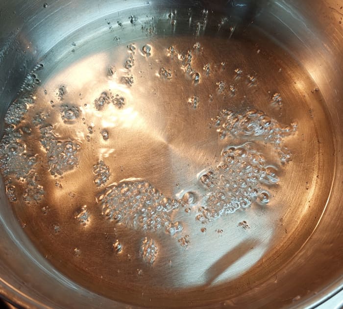 Boil for 3–4 minutes or until the sugar solution thickens a bit (no need to wait for string consistency).