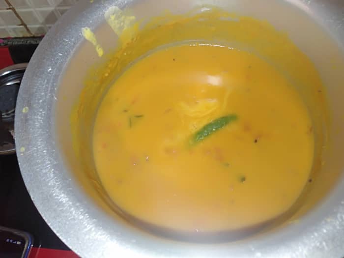 Cook for 5 minutes over low flame. Adjust the consistency by adding water to your preference. Switch off the flame.