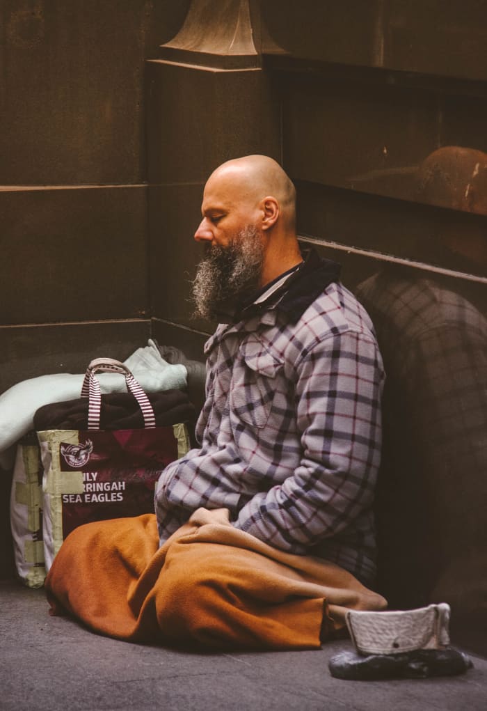 This homeless man in the corner in Sydney, Australia is symbolic of the album's title because when you are homeless it is easy to get into a feeling of despair.