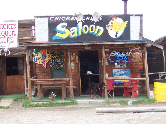 Who says a place can't be named after a bird? Chicken has a population of 7 (not including the dog in the picture).