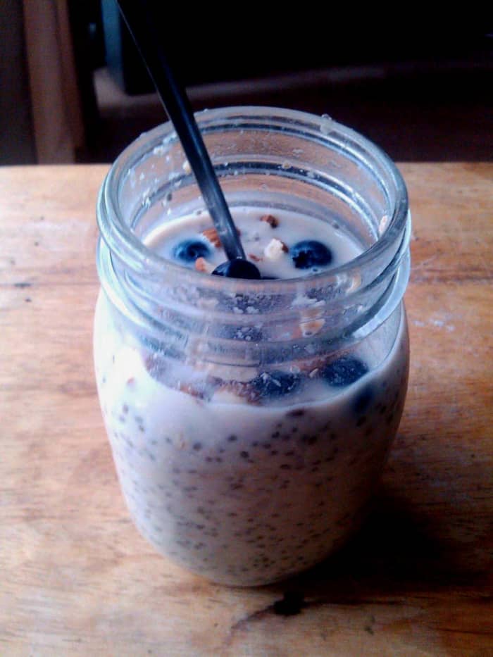 Overnight oats with soya milk, banana, blueberries, almonds, chia seeds and milled linseed