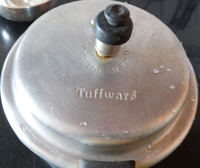 Close the lid and pressure cook for 3 whistles. Switch off the flame and let the pressure subsides naturally.