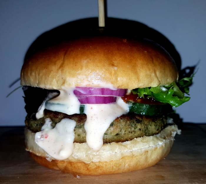 Old school packet mix burger with salad, peri-peri mayo and tomato relish in a broche bun