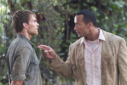Scott (left) and Rock (right) are a decent comedy pairing, allowing the Rock to flex his comic timing as much as his muscles.