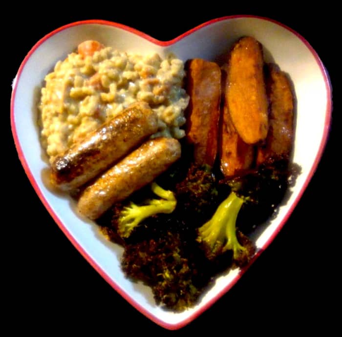 Creamy barley risotto with mushroom and tomato, served with vegan sausages, sweet potato wedges and roasted broccoli.