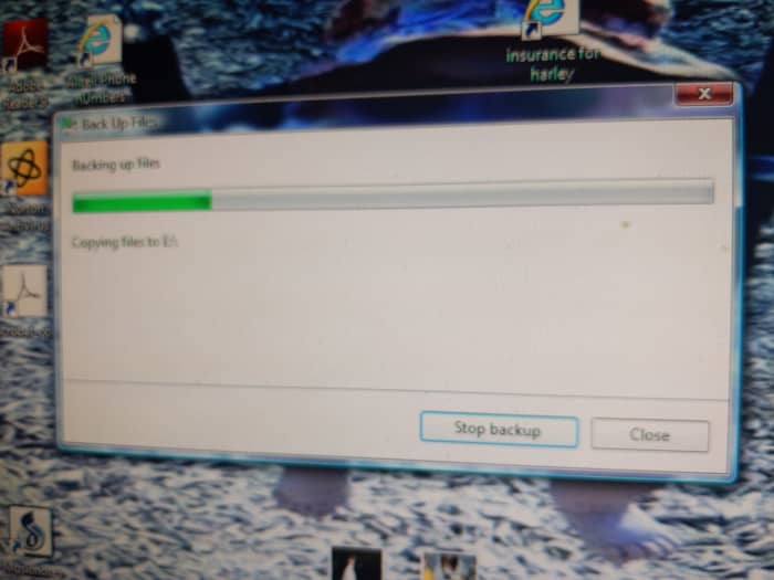 Backing up files to E:. E is the name of my disk drive. Copying files to E:/ it's a slow process. Fan is bowing. There are clicking sounds the light on the CD drawer is blinking. Sounds like a car in traffic. Speed up. Hit the brakes. Light flashing