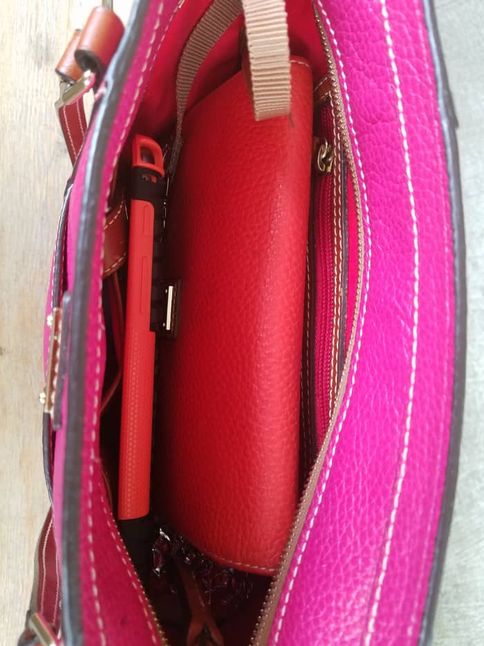 Yes, room enough for an orange wallet, lipstick, tablet (in day-glo orange protector), a mozzarella stick, mints, bizcards, phone and small miscellany.