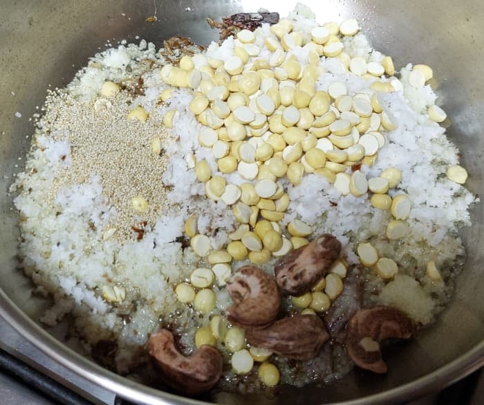 Add 1/2 cup fresh grated coconut, 2 tablespoons fried gram, 1 tablespoon poppy seeds and 4–5 cashews. Fry till aromatic.