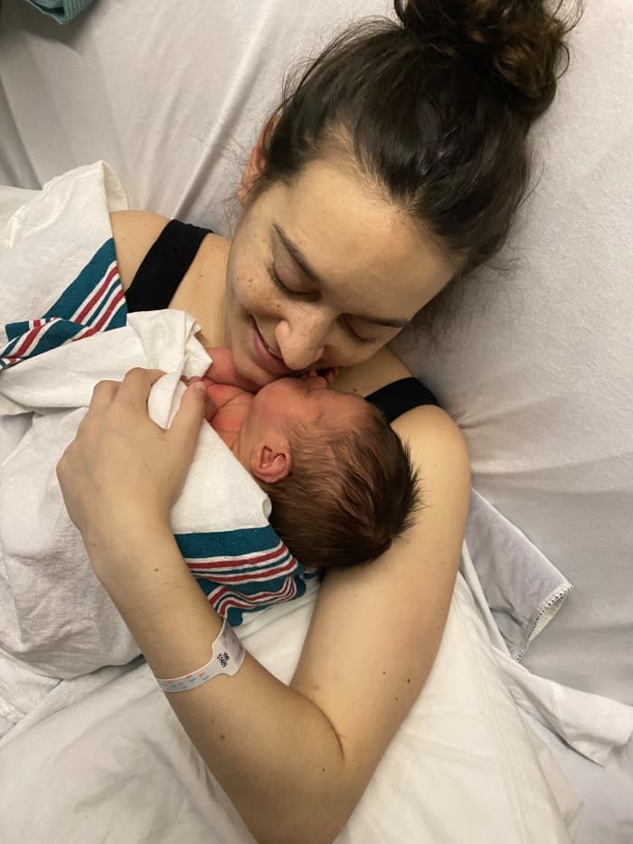 The proud new mother finally gets to hold her little man unassisted two days after delivery. She and husband Jordan Riley named their son Levi.