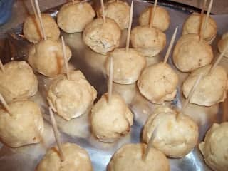 I like to insert toothpicks before refrigerating to make things faster when I dip into the chocolate. Then I leave them in the truffles for easy serving later.