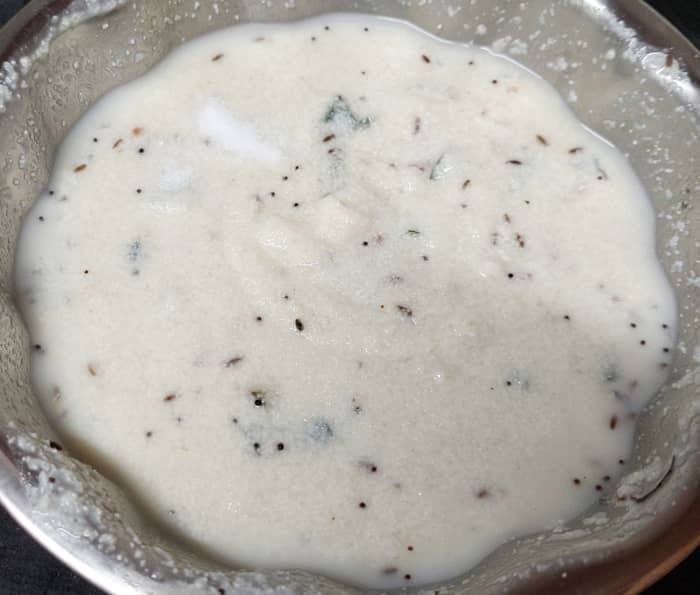 Mix and combine well. Add 1/2 cup of water (or as required), and mix well (consistency of the batter should be like idli batter, not too thin nor too thick but pouring consistency). Add salt to taste.