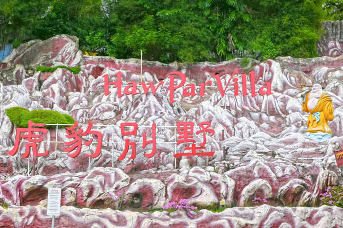 The entrance sign of Haw Par Villa offers a hint of the weird attractions found within this macabre statue theme park.