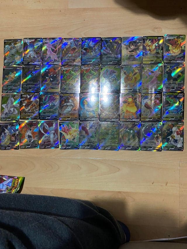 A collection of fake Pokémon cards, displayed by a Redditor who unfortunately purchased a counterfeit booster box.