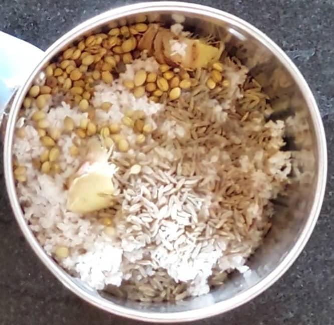In a mixer jar, add 1/2 cup of grated fresh coconut, 2 inches long ginger, 1 tablespoon cumin seeds, 1 tablespoon coriander seeds.