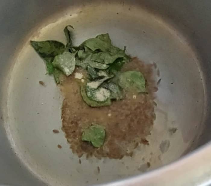 In a cooker, heat 1 tablespoon of cooking oil, splutter 1 teaspoon of cumin seeds, add 1 spring of curry leaves, 1/2 teaspoon of hing or asafoetida, fry.
