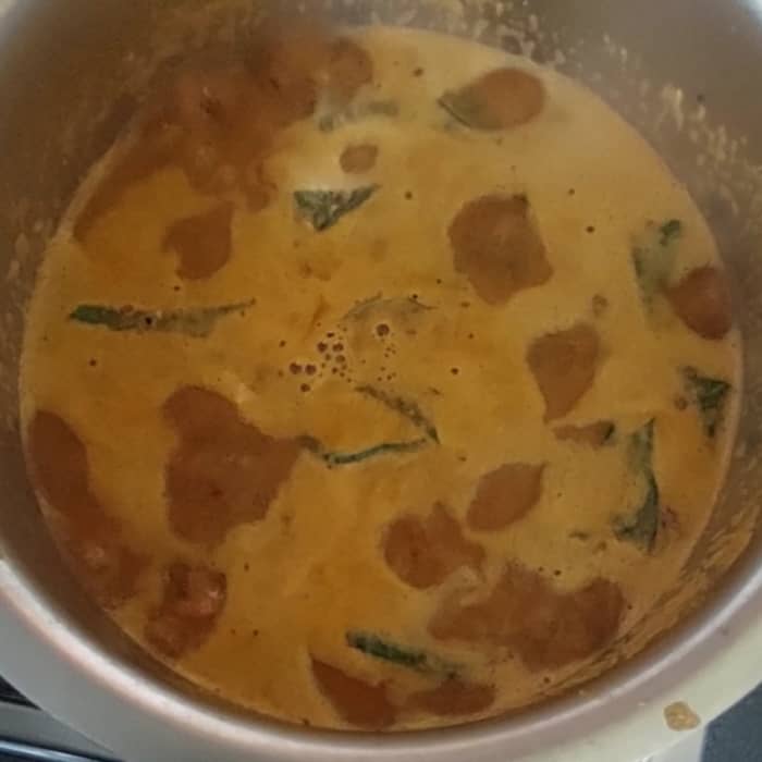 Combine well and boil for 2-3 minutes or till the raw smell of tamarind goes away. Switch off the flame.