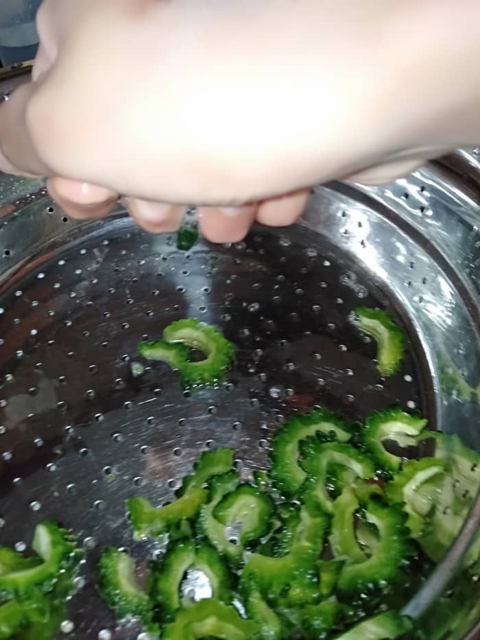 Or squeeze the sliced pieces again to remove the water. This will get rid of the bitterness from the bitter gourd.