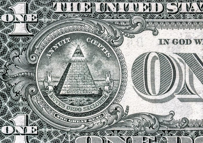The all-seeing eye atop the pyramid on the back of the dollar bill. "Novus Ordo Seculorum" means "New Order of the Ages."