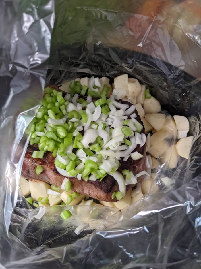 Roast in bag. Cover with celery, onions, carrots and fluid from pan drippings mixed with Lipton and 1/2 cup water.