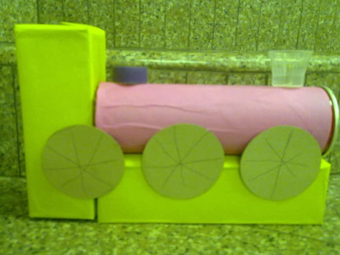 We made this toy train out of toilet paper rolls, pringles can and excess color paper. His favorite train at no cost!