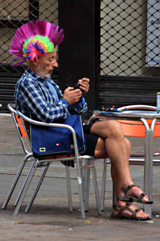 Everyone - even this guy - gets into Carnival spirit. He was just a spectator relaxing at a cafe before the start of the parade
