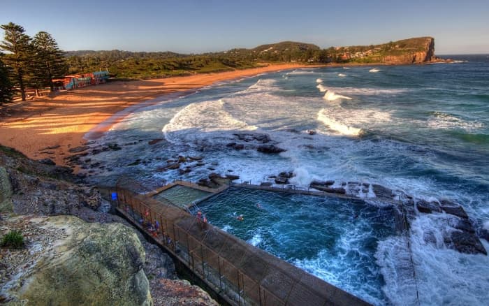 The shores of Avalon Beach, as it appeared during Cassandra's youth in the 1950's (top) and today (above).