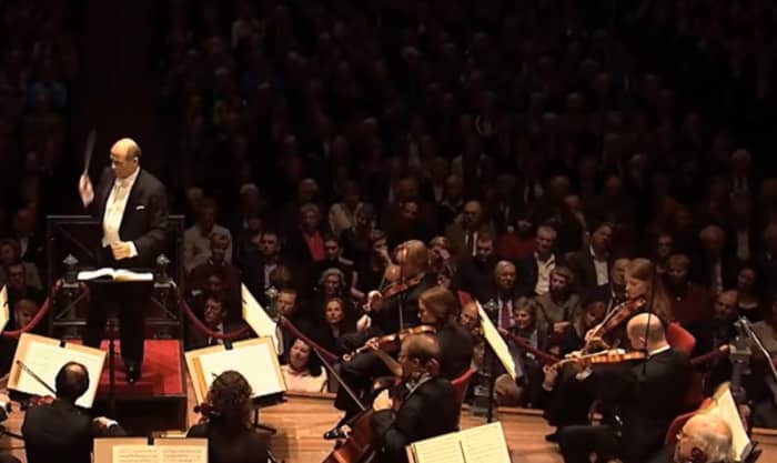 Audience listening intently and quietly in concert of Royal Concertgebouw Orchestra, conducted by Iván Fischer in 2015.
