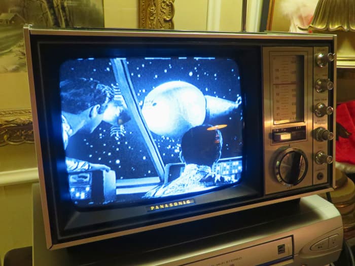 Professor John Robinson and Major Don West Looking at the Huge Alien Space Ship. It is all in crystal clear focus on the Panasonic Solid State Model TR-339RN Television