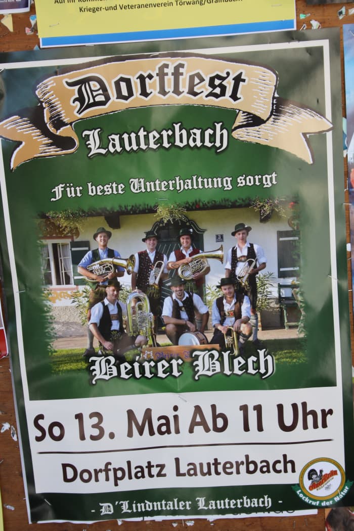 This is a flyer of Lauterbach Dorffest. Typical bavarian men´s wear (Lederhosen) on a concert.