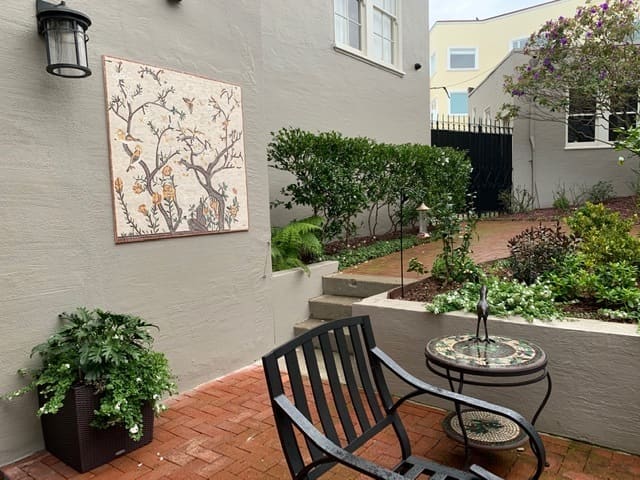 You don't have to get too fancy with outdoor mosaic installations. You could simply hang one on a wall.
