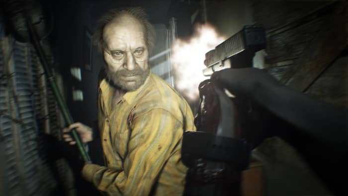 Jack Baker (left) relentlessly pursues Ethan Winters (right) through the dark corridors of the house.