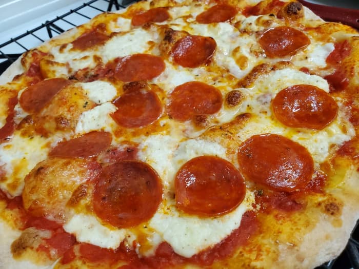 Homemade crispy New York-style pizza. Make it in your home oven, no pizza stone required!