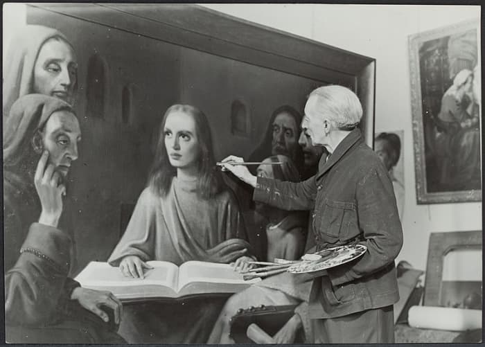 Van Meergeren is shown painting Jesus Among the Doctors in Vermeer's style to demonstrate his skill as a forger.